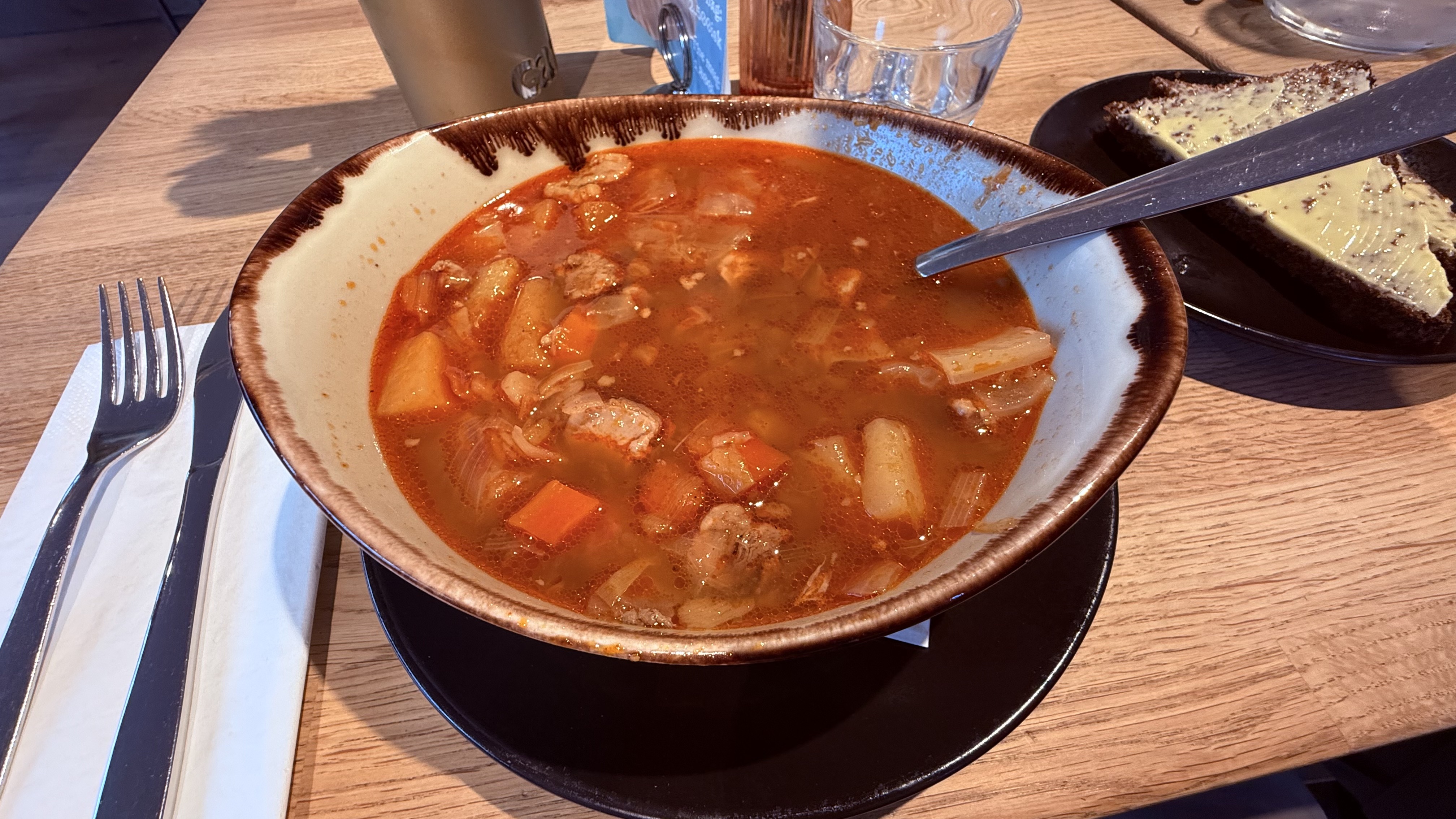 Hearty lamb soup with homemade rye bread
