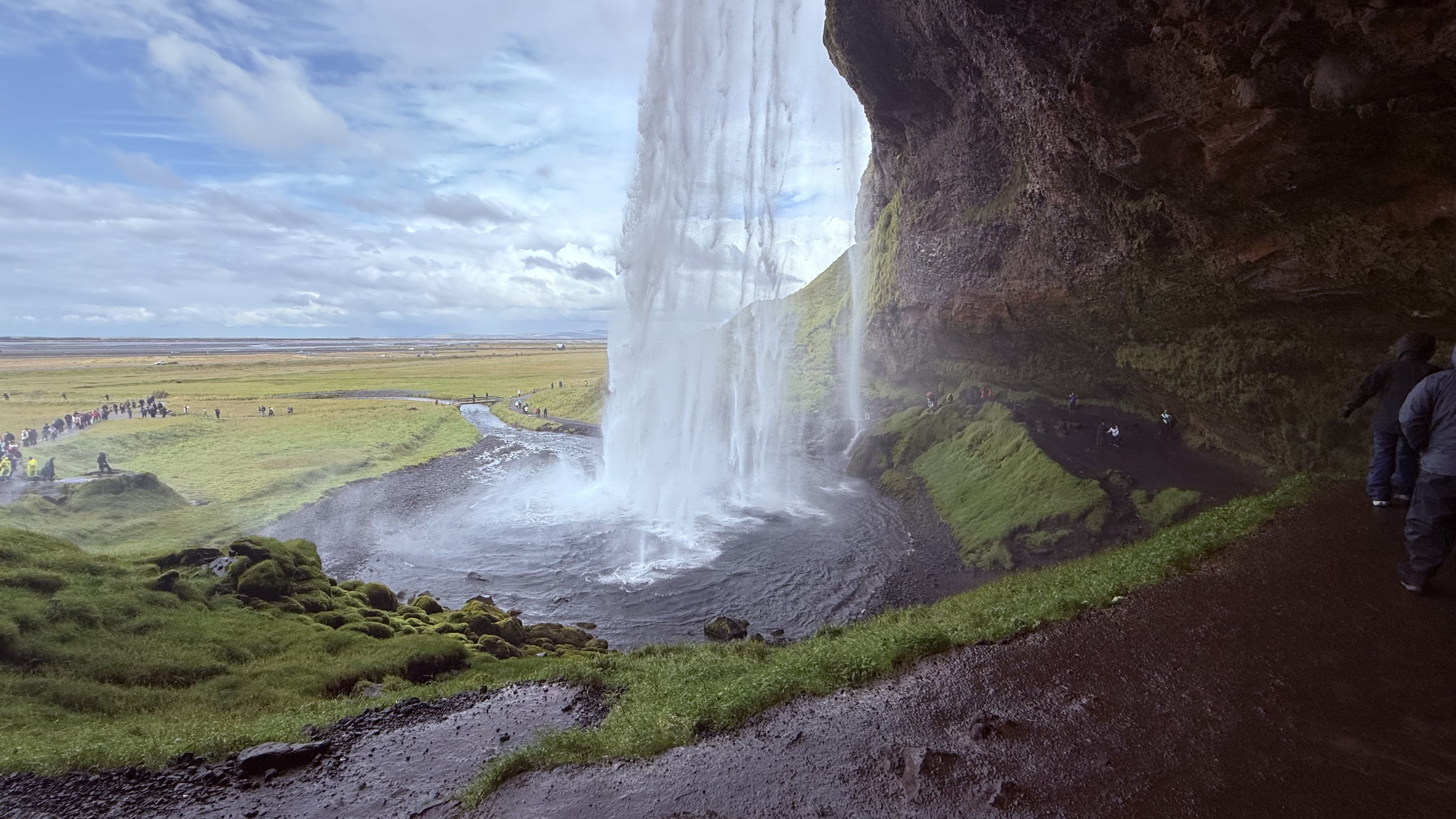 The view from behind Seljalandsfoss &mdash; looking out through the falls