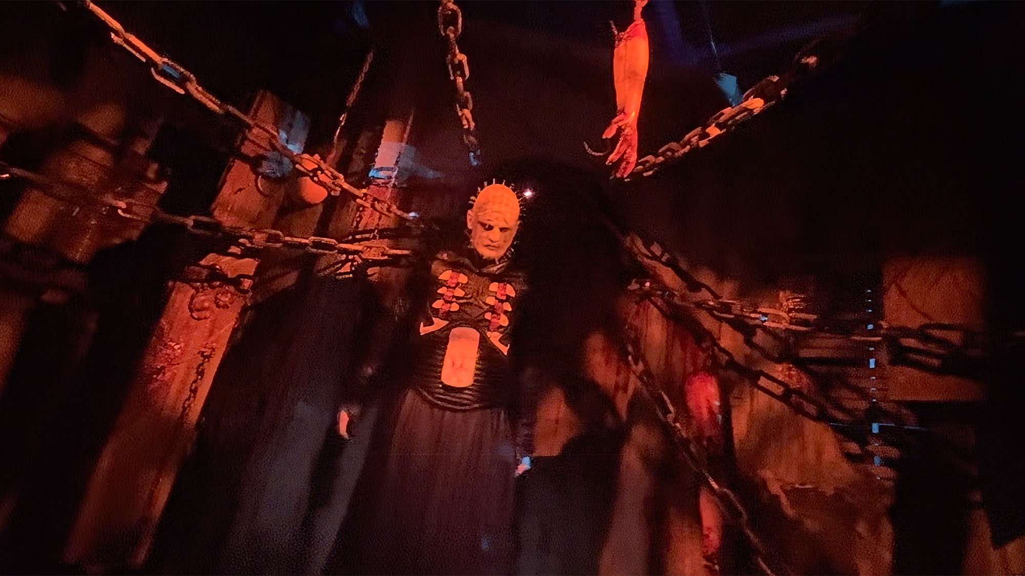Pinhead surrounded by hanging chains in the Hellraiser house