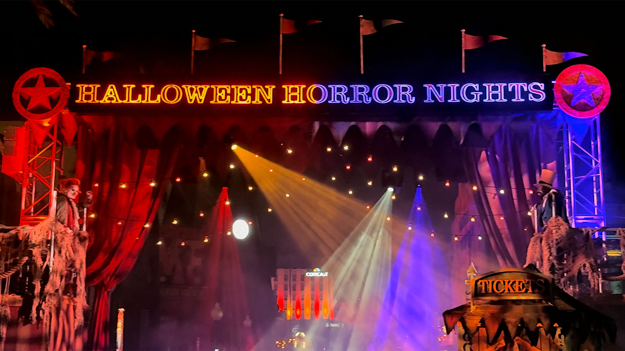 The Halloween Horror Nights entrance gate lit up at night